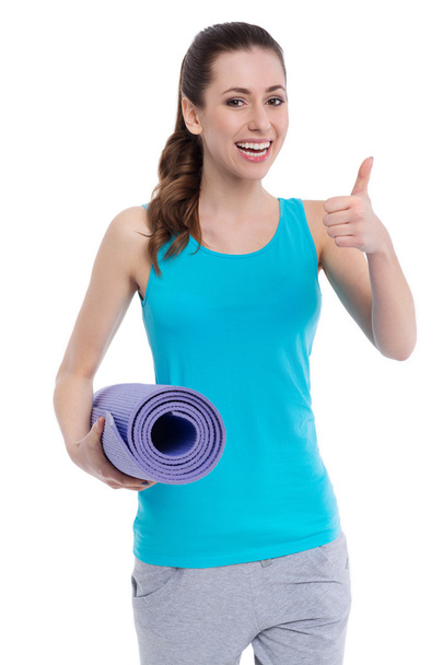 Woman holding exercise mat - Photo, Image
