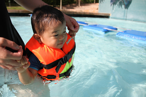 Japanese boy swiming in the pool (1 year old) - Photo, Image