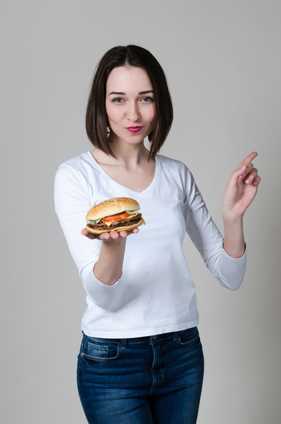 Girl eating healthy sandwich isolated on white background - Фото, зображення