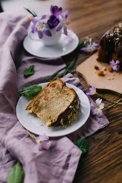 Piace of cake with flowers around and coffee - Photo, image