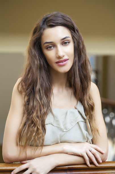 Portrait close up of young beautiful brunette woman in beige dre - Fotó, kép