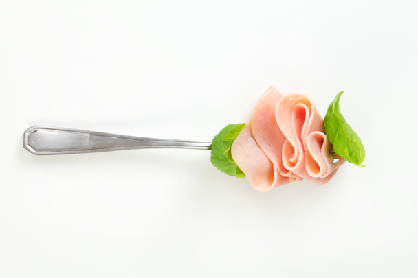 Slices of ham on fork - Photo, Image