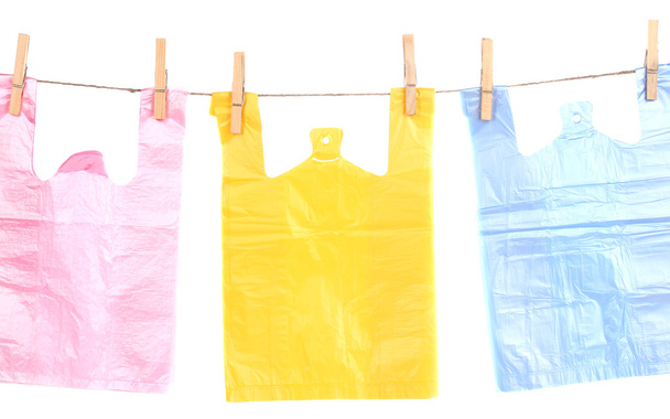 Cellophane bags hanging on rope isolated on white - Photo, Image