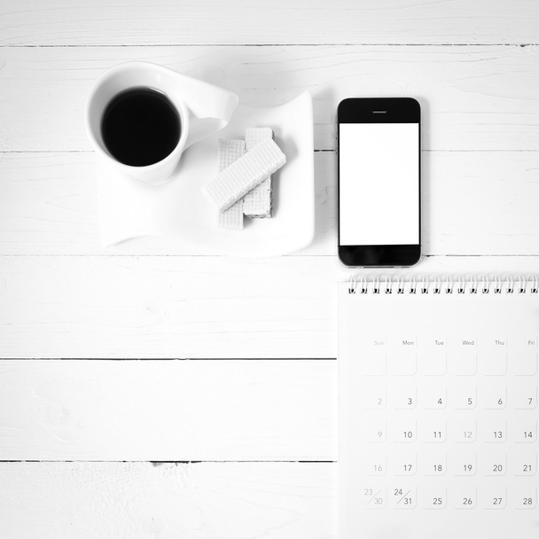 coffee cup with wafer,phone,calendar black and white color - Foto, afbeelding