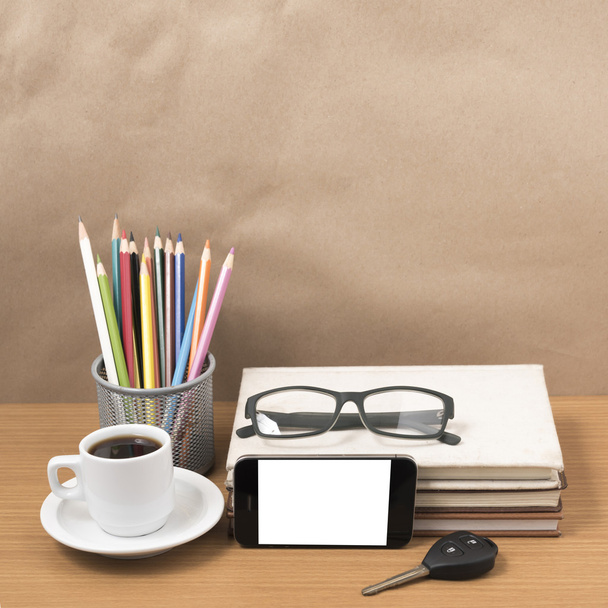office desk : coffee and phone with car key,eyeglasses,stack of  - Foto, Imagem
