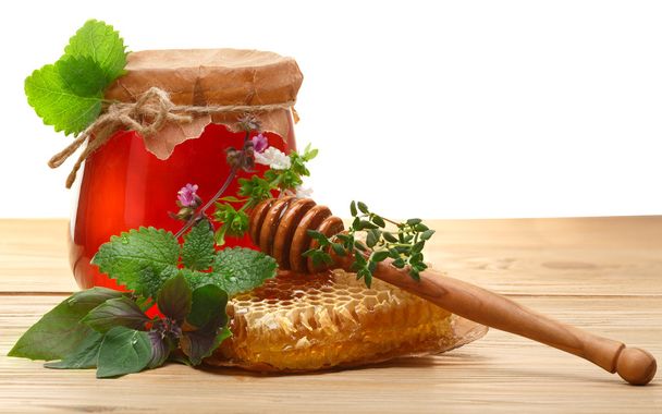pot honing op houten tafel - Foto, afbeelding