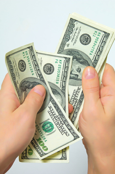 Cash US dollars in hand. - Фото, зображення