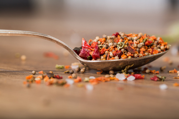 Spoon with spices on the table, close-up - Photo, Image