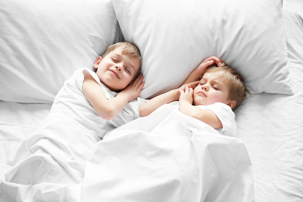 Cute boys sleeping in bed under blanket, closeup - Foto, Imagem