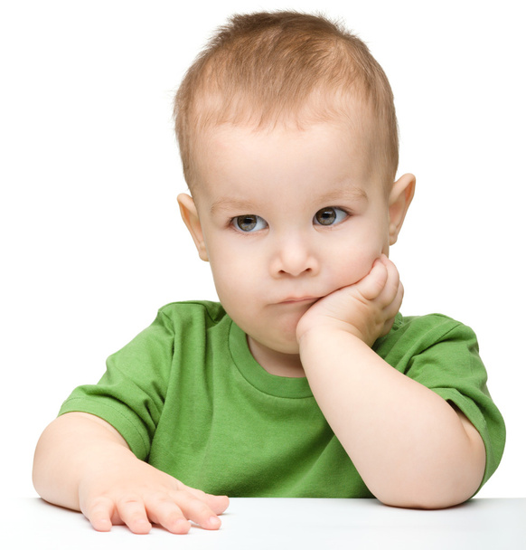 Portrait of a cute and pensive little boy - Foto, imagen
