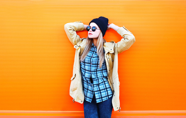 Fashion pretty woman model over colorful orange background - Foto, Bild
