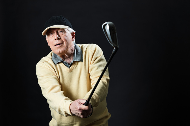 Studio portrait of senior golf man. - Photo, Image