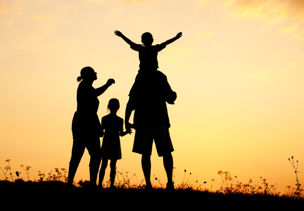 Happy family in nature at sunset - Photo, Image