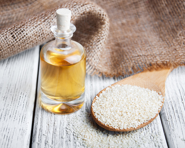Sesame seeds and bottle with oil - Photo, Image