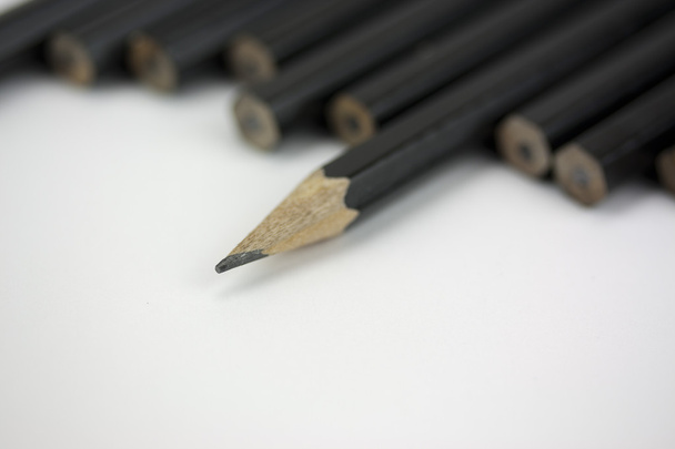 Fechar de lápis em uma linha
 - Foto, Imagem