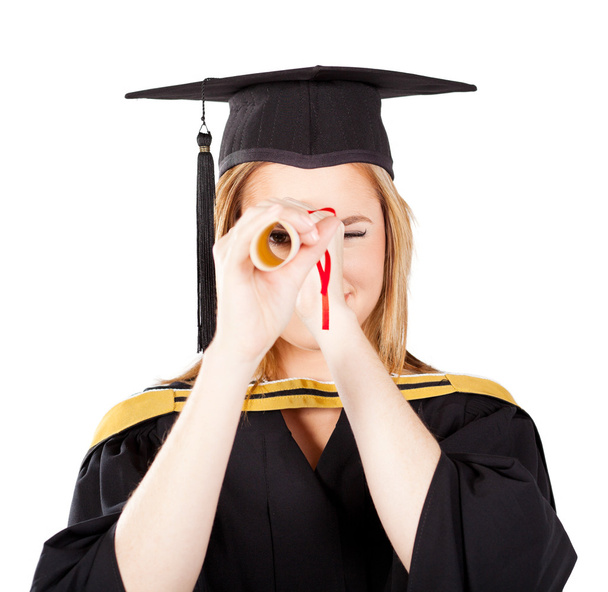 Female graduate looking through her certificate - Photo, Image