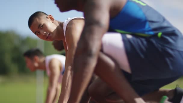 athletes at running track - Filmati, video