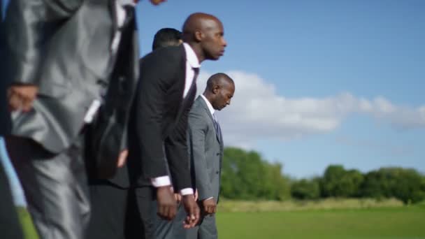businessmen at running track line up at starting line - Footage, Video