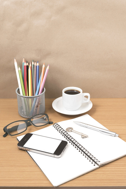 office desk : coffee and phone with key,eyeglasses,notepad,penci - Фото, изображение