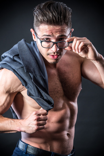 Muscular young man in glasses - Фото, изображение
