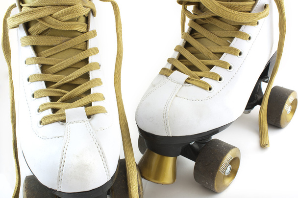 Gold and white rollerskates - Photo, Image