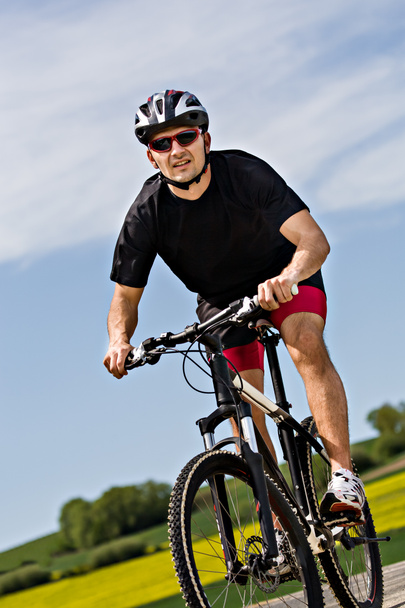 Ποδηλασία άνθρωπος - Φωτογραφία, εικόνα