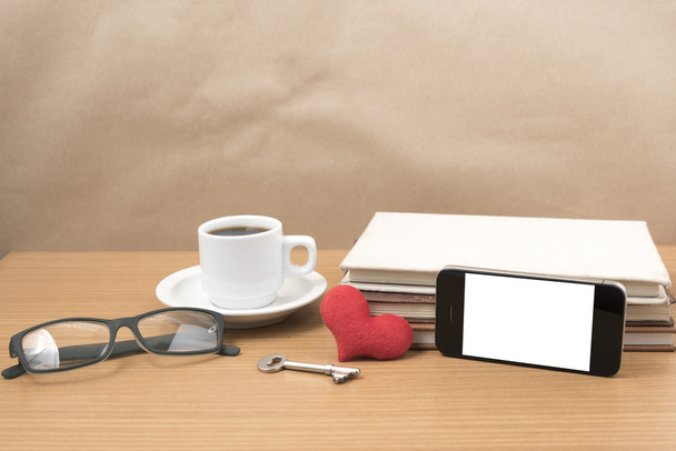 office desk : coffee and phone with key,eyeglasses,stack of book - Zdjęcie, obraz