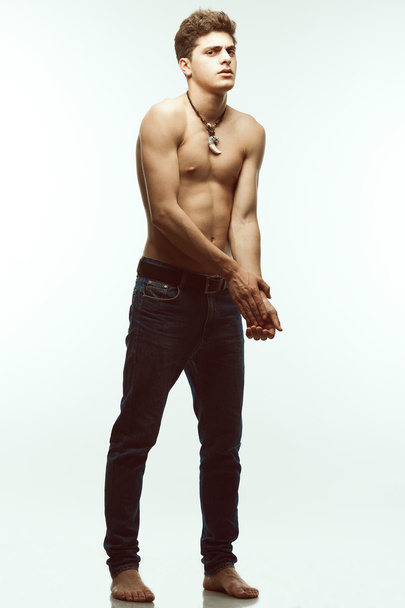 Male beauty & Blue jeans concept. Handsome male model in jeans - Photo, image