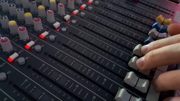 DJ Fingers control the sound on an audio mixer - Footage, Video