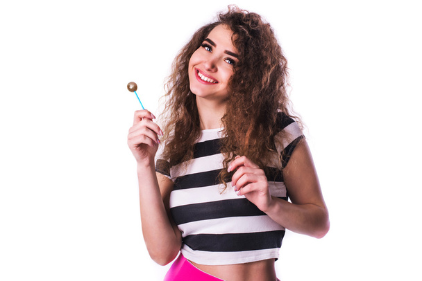 Curly woman holding lolly pop isolated on white - Photo, Image