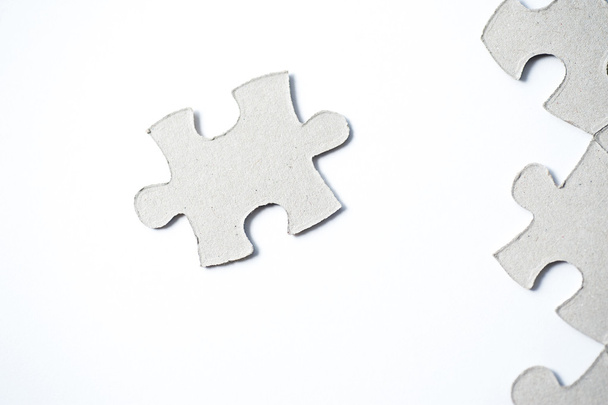 cardboard puzzles pieces on a white background - Photo, Image