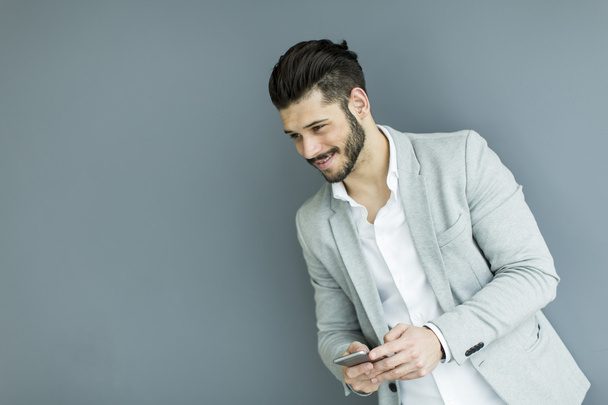 Handsome man with a phone - Photo, Image