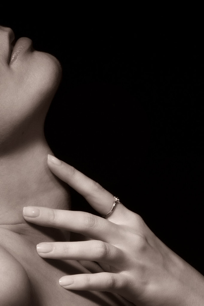 Young woman with touching her neck - Valokuva, kuva