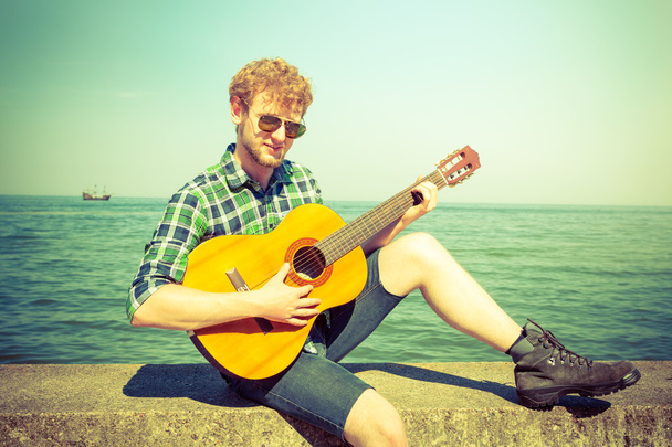Young man guy playing guitar. - Foto, Bild