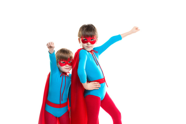 Two boys playing in a superhero isolated. - Foto, immagini