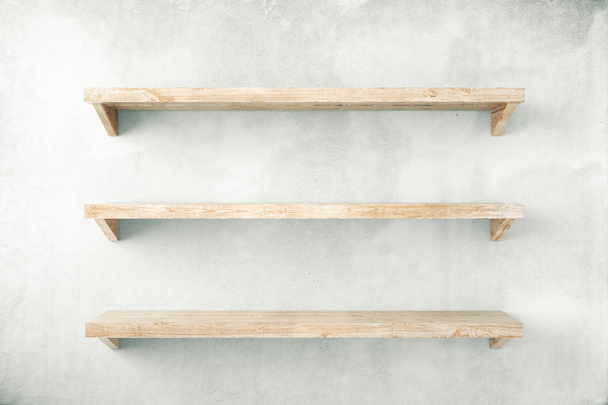 Empty shelves on concrete wall - Foto, imagen