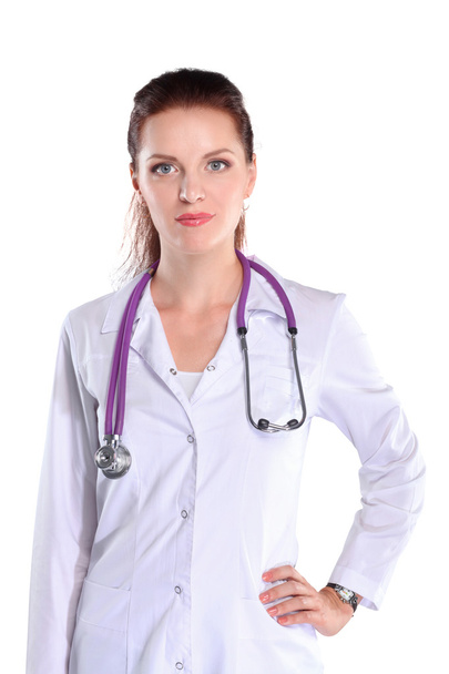 Portrait of young woman doctor with white coat standing in hospital - 写真・画像