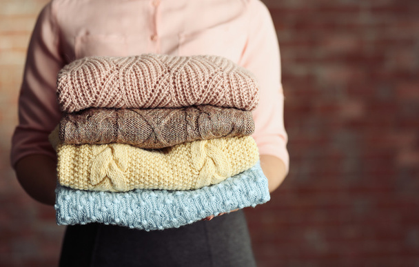 Stack of knitted clothes   - Foto, Bild