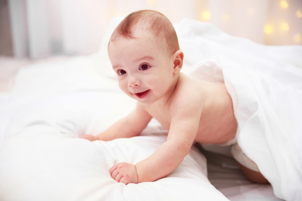 adorable baby on soft bed - Фото, изображение
