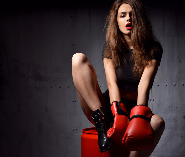 Beautiful sexy woman with red Boxing Gloves at the gym concept a - Foto, Imagen