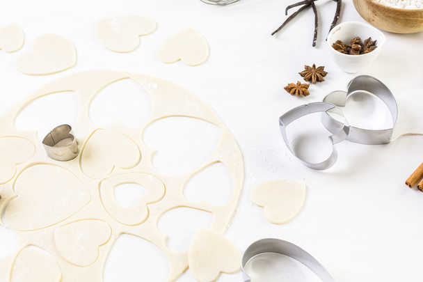 Baking heart shaped sugar cookies - Фото, изображение