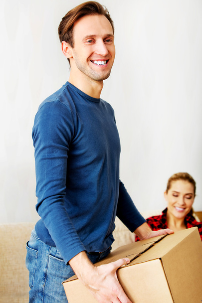 Young couple with boxes - packing or unpacking - Photo, Image