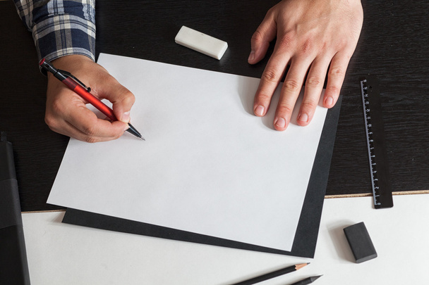 Man draws a sketch on the table, architector - Photo, image