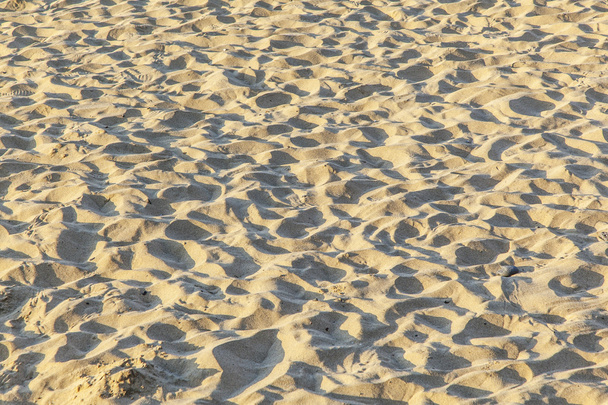 Marks of feet at the sandy beach - Fotografie, Obrázek