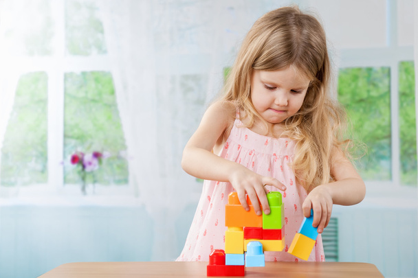 Cute girl playing with a toys - Photo, Image