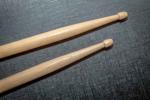 Wood Drumsticks in black texture background - Photo, Image