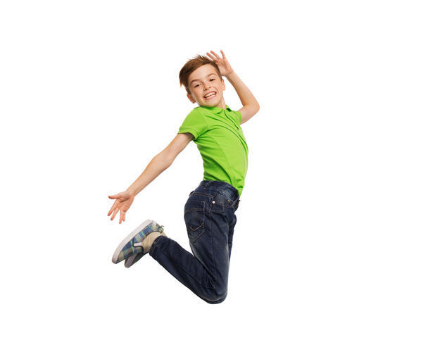 smiling boy jumping in air - Foto, afbeelding