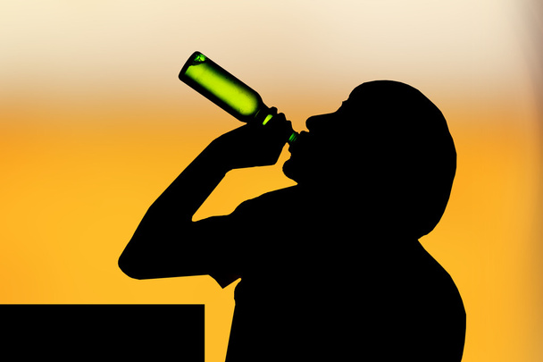 Silhouette of drinking man - Photo, Image