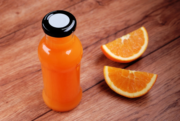 Orange juice in the bottle - Zdjęcie, obraz