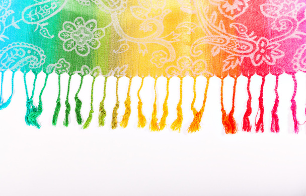 The colors of the rainbow bands on Indian fabric as a background - Foto, afbeelding